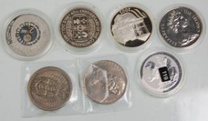 A mixed group of seven silver coins to include Isle Of Man 2000 silver proof Millennium Crown,