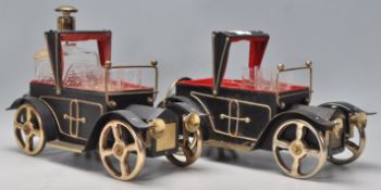 A pair of vintage retro drinks ebonised wooden caddy's in the form of motor cars with fitted