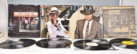 A group of four vinyl long play LP record albums by Elton John to include Tumbleweed Connection,