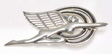 A stamped 925 silver pendant in the form of a stylised winged female figure with black enamel