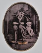 A stamped 925 silver pill box of oval form having a domed lid with a black and white enameled