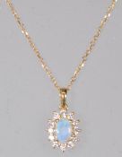 A stamped 18ct gold pendant necklace having a pendant set with an opal within a halo of round cut