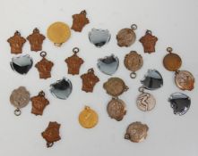 A collection of vintage 20th Century pocket watch chain fob medals / pendants most of sporting