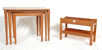 A vintage retro mid 20th Century teak wood magazine rack together with a teak nest of three tables
