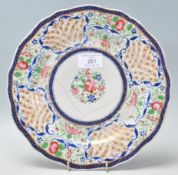A 19th Century Chinese polychrome plate for the Persian market, decorated with a peony to the