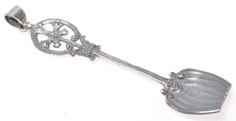 A stamped 925 silver caddy spoon having a pierced decoration finial with reeded decoration, with a
