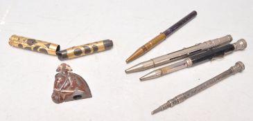 A collection of vintage 20th Century mechanical pens to include a silver propelling pencil set