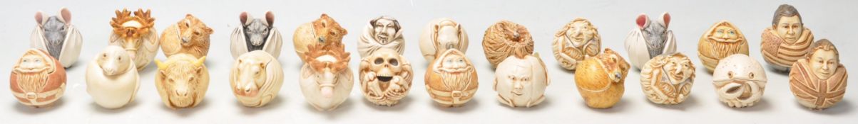 A group of twenty four Harmony Kingdom novelty spherical figurines / boxes to include Queen
