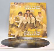 A vinyl long play LP record album by Hollies – Hollies Sing Hollies – Original black and yellow