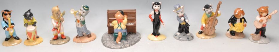 A group of ten Beswick cat band figurines to include Glam Guitar CC10, Calypso Kitty CC2, One Cool
