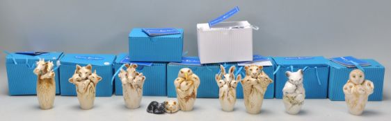 A collection of ten Adam Binder animals related netsuke style resin figurines to include giraffe,
