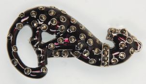 A stamped 925 silver brooch in the form of a jaguar having a black enamelled finish, set with