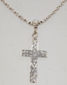 A good 19th Century Victorian silver cross pendant on a silver chain having a spring ring clasp.
