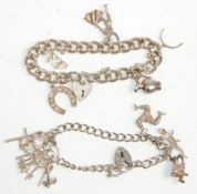 Two silver charm bracelets with both having heart padlocks and silver safety chains. Adorned with