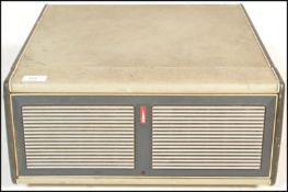 A vintage 20th Century portable record player by Bush, fitted with a four speed record deck by