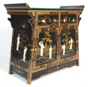 A 20th Century Chinese lacquered sideboard cupboard having a two drawers with twin cupboards below