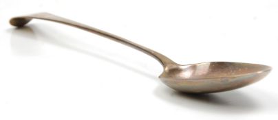 An 18th Century Georgian silver serving spoon of long form having a 'W' monogram to the handle.