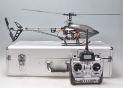 A contemporary remote control toy helicopter having a fibreglass body having an E fly ETC61 remote