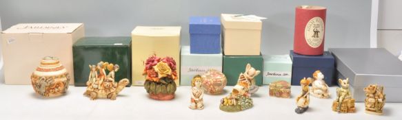 A mixed group of twelve carved resin figures / trinket pots to include examples from Harmony Garden,