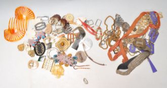 A collection of vintage 20th Century mixed belt buckles to include early plastic examples, mother of