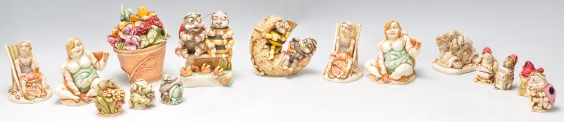 A collection of fifteen resin Harmony Kingdom garden related novelty figurines to include figures at