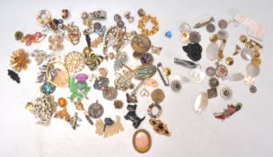 A collection of vintage 20th Century brooches to include a group of 19th Century mother of pearl