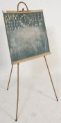 A vintage retro 1950's school black board having alphabet letters, a clock with moveable hand and