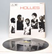 A vinyl long play LP record album by Hollies – The Hollies – Original black and yellow 1st U.K.