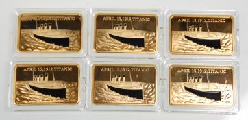 A group of six Tragedy of the Titanic gold layered fine silver gold layered commemorative troys each