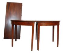 A 19th Century  George III solid mahogany D end dining table having a round top with additional
