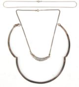 A group of three ladies silver necklaces to include a three panel collar necklace bearing London