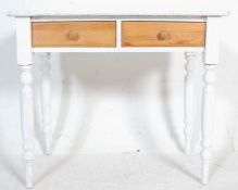 A 19th Century Victorian shabby chic painted pine writing table desk raised on turned legs with twin