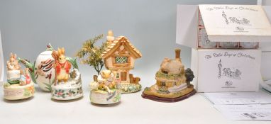 A mixed group of mostly ceramic figures to include 3x Beatrix Potter Musical figures, teapot with