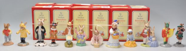 A group of twelve Royal Doulton Bunnykins ceramic figurines to include Sweetheart DB 130, Rainy