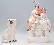 A 19th Century Victorian Staffordshire figurine in the form a Scottish kilted bagpipe player and a