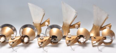 A set of vintage retro gilt wall mounting lights each having a textured gilt finish with conical