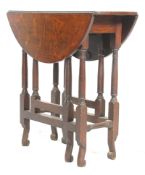 A 1920's solid oak gate leg folding leaf occasional side table raised on block and turned legs