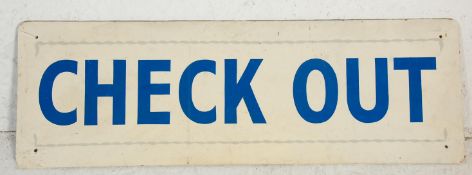 A vintage 20th Century 'Check Out' sign board having white ground with blue lettering.