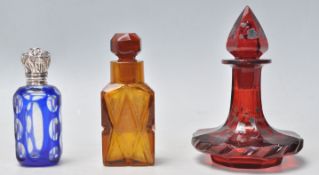 A group of three antique perfume scent bottle to include a 19th Century Victorian blue flash glass