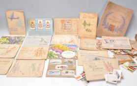 A collection of vintage cigarette card books Players International Liners, Wills's The Sea Shore,