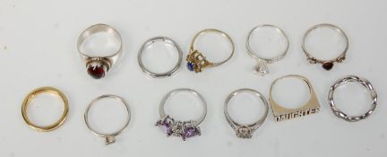 A collection of eleven silver ladies dress rings to include a red stone cabochon ring, a ring set