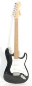 A Squier Strat by Fender Affinity Series Stratocaster electric guitar having a black body with white