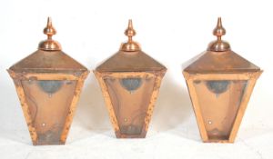 A group of three Victorian style street lantern light fittings constructed from copper with