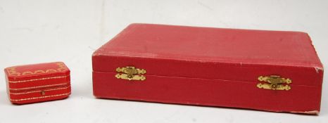 Two vintage red leather Cartier jewellery boxes to include and earrings box having gilt tooled lid