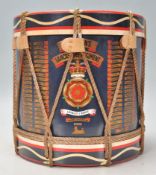 A 20th Century vintage military related ice bucket in the form of a drum having a black