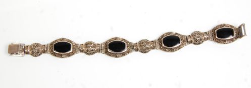 A good vintage 20th Century silver and marcasite ladies bracelet set with onyx set panels. Stamped