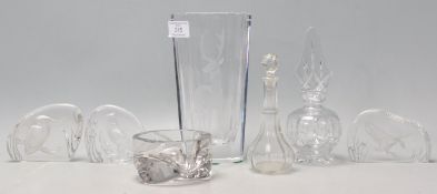 A collection of 20th Century etched glass ornaments to include a cut glass vase in with etched
