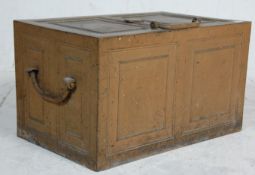 A large and heavy 19th century antique cast-iron strong box / safe, the hinged lid with central