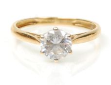A hallmarked 18ct gold solitaire ring set with a round cut white stone. Hallmarked Birmingham 2008.