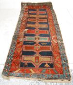 A good vintage 20th Century hand woven Persian / Islamic floor rug / runner having a red and blue